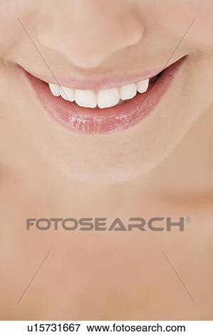 Stock Photo - Close-up of young woman's smile. Fotosearch