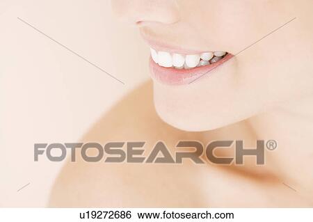 Close-up of young woman's smile View Large Photo Image Stock Photograph - Close-up of young woman's smile. Fotosearch