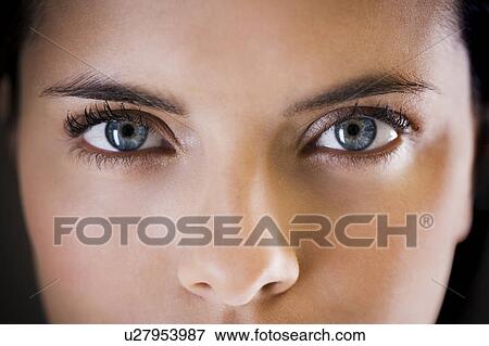 Close-up portrait of a young woman View Large Photo Image Stock Photo - Close-up portrait of a young woman. Fotosearch