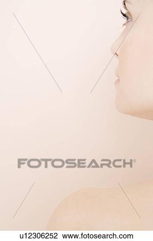 Stock Image - Detail of side of woman's face. Fotosearch