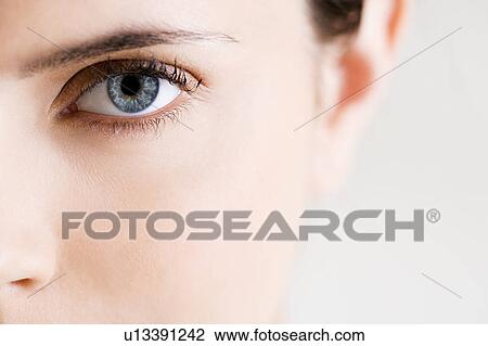 Detail of woman's face showing left eye with blue iris View Large Photo Image Stock Image - Detail of woman's face showing left eye with blue iris. Fotosearch