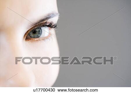 Stock Image - Detail of woman's face showing left eye. Fotosearch