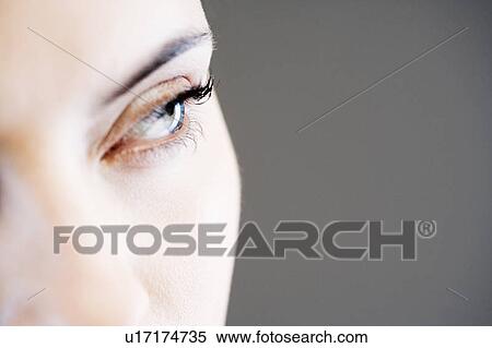 Stock Photography - Detail of woman's face showing left eye. Fotosearch
