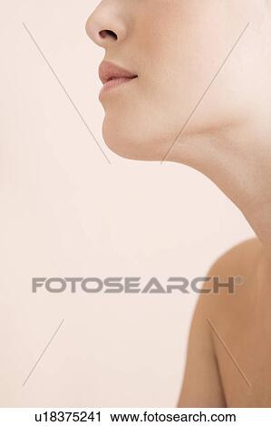 Stock Image - Detail of young woman's face showing chin, nose and mouth. Fotosearch