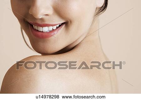 Lower half of a young woman's face, smiling View Large Photo Image Stock Photo - Lower half of a young woman's face, smiling. Fotosearch
