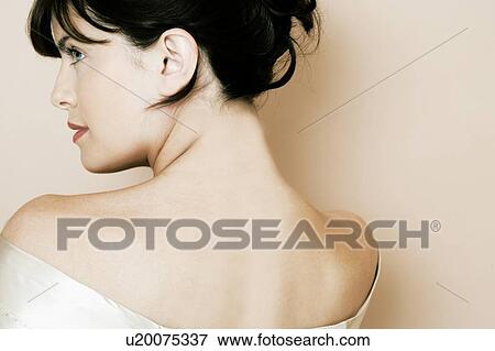 Elegant young woman in a white silk dress or wrap View Large Photo Image Stock Photo - Elegant young woman in a white silk dress or wrap. Fotosearch