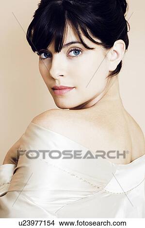 Portrait of elegant young woman in a white silk dress or wrap View Large Photo Image Picture - Portrait of elegant young woman in a white silk dress or wrap. Fotosearch