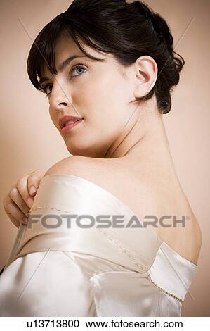Portrait of elegant young woman in a white silk dress or wrap View Large Photo Image Stock Image - Portrait of elegant young woman in a white silk dress or wrap. Fotosearch