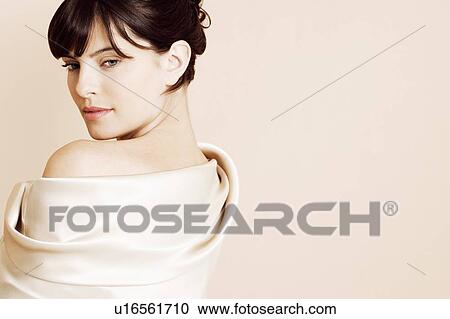 Portrait of elegant young woman in a white silk dress or wrap View Large Photo Image Stock Image - Portrait of elegant young woman in a white silk dress or wrap. Fotosearch