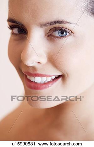 Portrait of young woman smiling View Large Photo Image Stock Image - Portrait of young woman smiling. Fotosearch