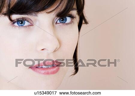 Portrait of young woman with brown hair View Large Photo Image Stock Photo - Portrait of young woman with brown hair. Fotosearch
