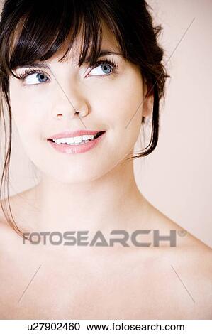 Portrait of young woman with brown hair, smiling View Large Photo Image Stock Image - Portrait of young woman with brown hair, smiling. Fotosearch