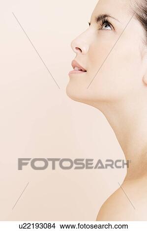 Profile of young woman looking upwards View Large Photo Image Picture - Profile of young woman looking upwards. Fotosearch