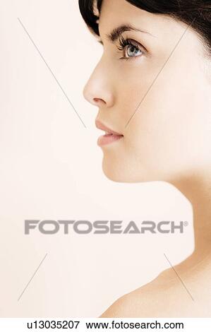 Stock Photo - Profile of young woman's face. Fotosearch