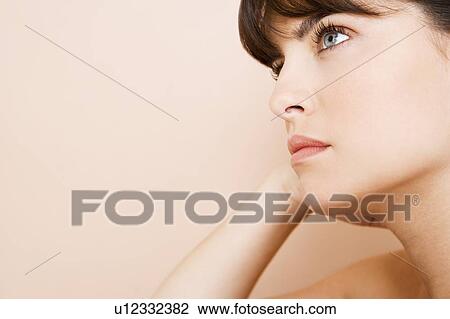 Young woman looking pensive, thinking View Large Photo Image Stock Image - Young woman looking pensive, thinking. Fotosearch