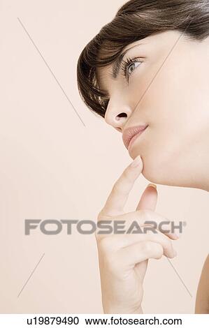 Young woman looking pensive, thinking View Large Photo Image Stock Image - Young woman looking pensive, thinking. Fotosearch