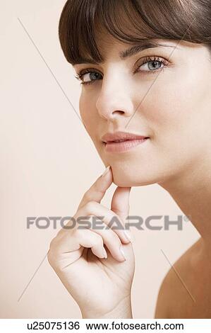Young woman looking pensive, thinking View Large Photo Image Stock Photograph - Young woman looking pensive, thinking. Fotosearch