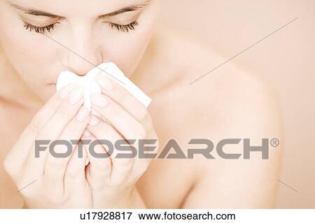 Woman blowing her nose View Large Photo Image Stock Photo - Woman blowing her nose. Fotosearch