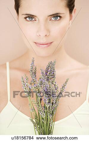 Woman holding a bunch of dried lavender View Large Photo Image Picture - Woman holding a bunch of dried lavender. Fotosearch