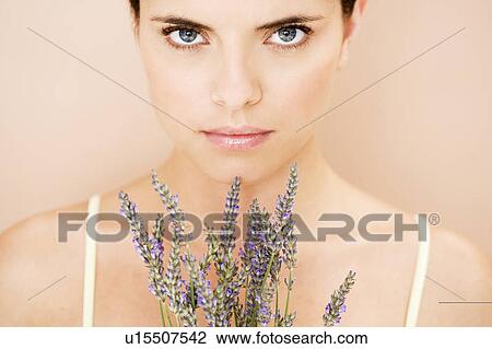 Woman holding a bunch of dried lavender View Large Photo Image Stock Image - Woman holding a bunch of dried lavender. Fotosearch
