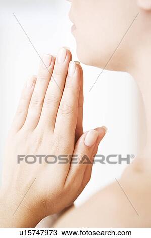 Young woman praying or meditating View Large Photo Image Stock Image - Young woman praying or meditating. Fotosearch