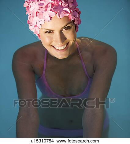 Picture - A woman in a bikini and swimming hat. Fotosearch