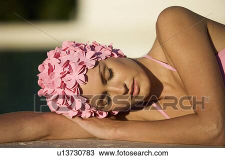 A woman in a bikini and swimming hat View Large Photo Image Stock Image - A woman in a bikini and swimming hat. Fotosearch