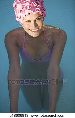 A woman in a bikini and swimming hat View Large Photo Image Stock Photo - A woman in a bikini and swimming hat. Fotosearch