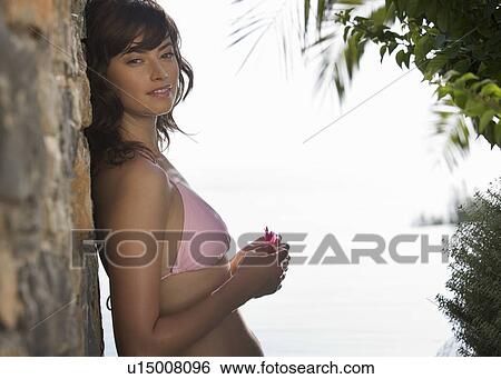 Stock Photograph - A woman in a bikini. Fotosearch