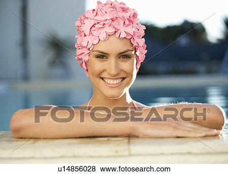 A woman in a swimming hat in a pool View Large Photo Image Stock Photo - A woman in a swimming hat in a pool. Fotosearch