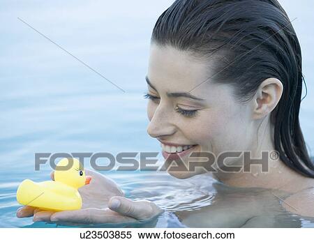 A woman relaxing in a pool View Large Photo Image Stock Photography - A woman relaxing in a pool. Fotosearch