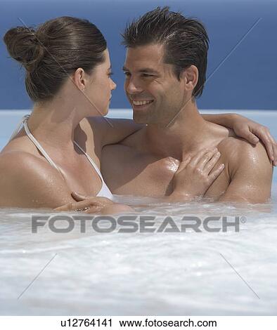 A couple relaxing in a jacuzzi View Large Photo Image Stock Image - A couple relaxing in a jacuzzi. Fotosearch