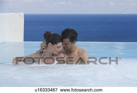 A couple relaxing in a jacuzzi View Large Photo Image Stock Photo - A couple relaxing in a jacuzzi. Fotosearch