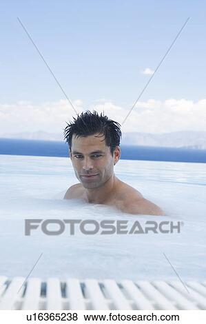 A man relaxing in a jacuzzi View Large Photo Image Stock Photo - A man relaxing in a jacuzzi. Fotosearch