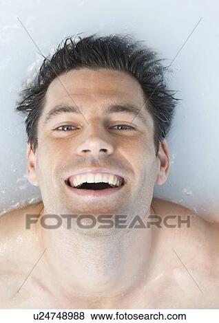 A man relaxing in a jacuzzi View Large Photo Image Stock Photo - A man relaxing in a jacuzzi. Fotosearch