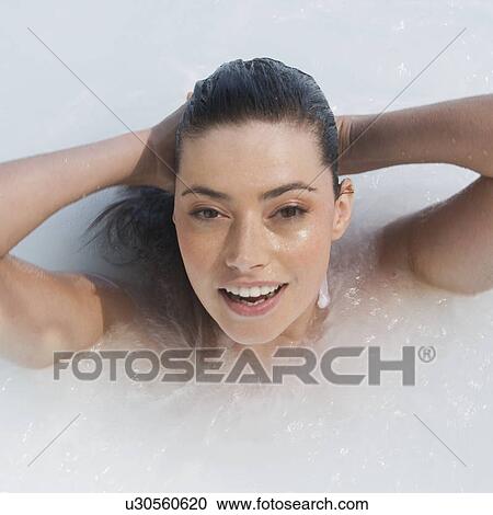 A woman relaxing in a jacuzzi View Large Photo Image Stock Image - A woman relaxing in a jacuzzi. Fotosearch