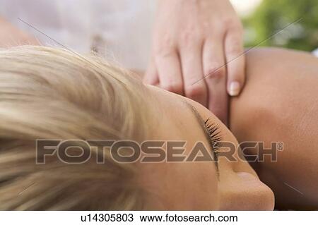 Stock Image - A young woman having a massage. Fotosearch