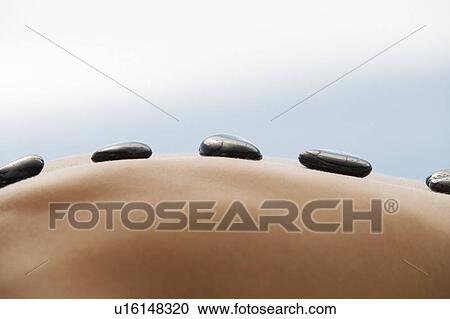 Close-up of a hot stone holistic treatment View Large Photo Image Stock Image - Close-up of a hot stone holistic treatment. Fotosearch