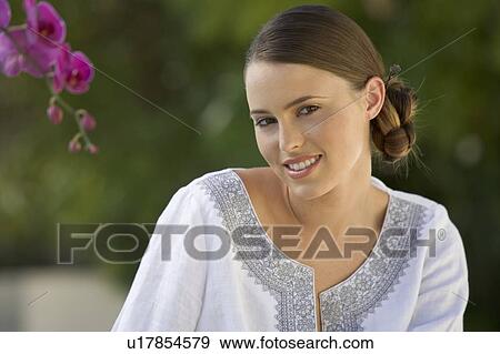 Portrait of a young woman View Large Photo Image Stock Photo - Portrait of a young woman. Fotosearch