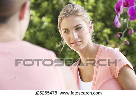 Two young women View Large Photo Image Stock Photo - Two young women. Fotosearch