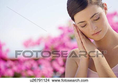 Picture - A woman relaxing in the sun. Fotosearch