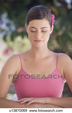 A woman with her eyes closed View Large Photo Image Stock Photo - A woman with her eyes closed. Fotosearch