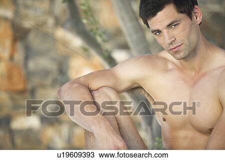 A man relaxing in the shade View Large Photo Image Stock Image - A man relaxing in the shade. Fotosearch