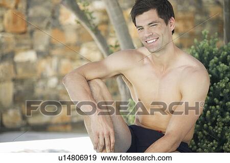 Stock Photo - A man relaxing in the shade. Fotosearch
