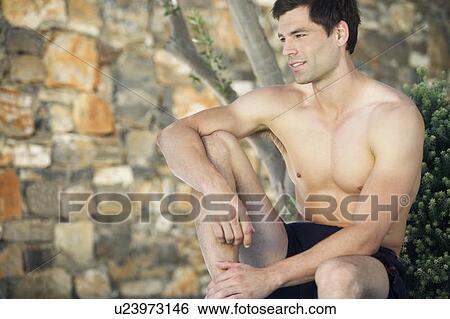 A man relaxing in the shade View Large Photo Image Stock Photograph - A man relaxing in the shade. Fotosearch