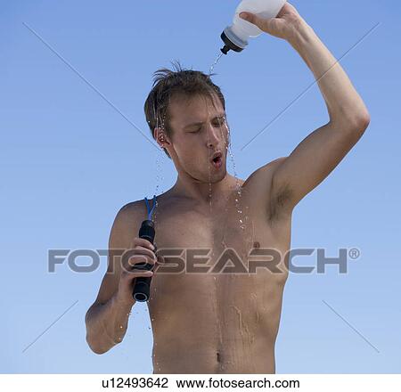 Stock Image - A young man cooling off after exercising. Fotosearch