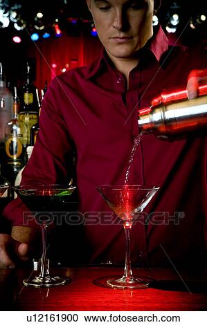 A barman mixing cocktails View Large Photo Image Stock Image - A barman mixing cocktails. Fotosearch