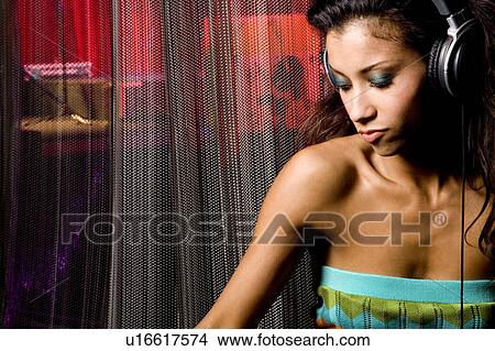 A young female DJ View Large Photo Image Picture - A young female DJ. Fotosearch