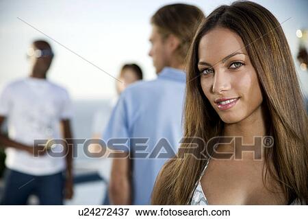 Young woman at a summer party View Large Photo Image Stock Photo - Young woman at a summer party. Fotosearch