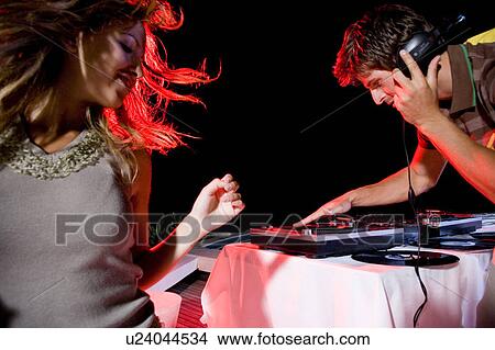 Young woman dancing by the DJ View Large Photo Image Picture - Young woman dancing by the DJ. Fotosearch